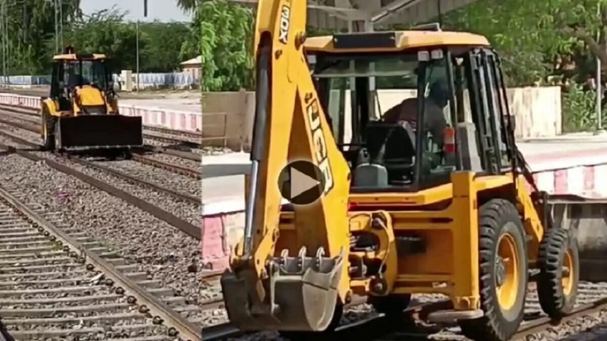 JCB on train tracks