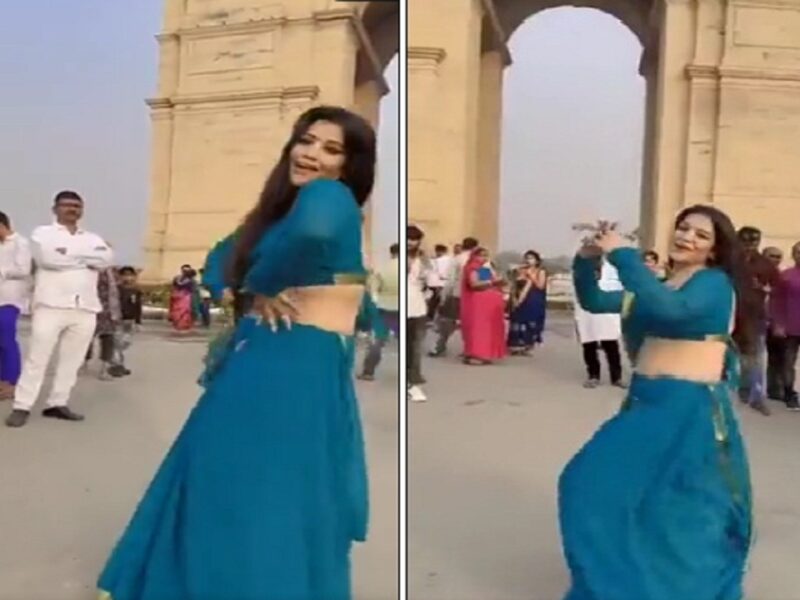 Girl dances in front of India Gate